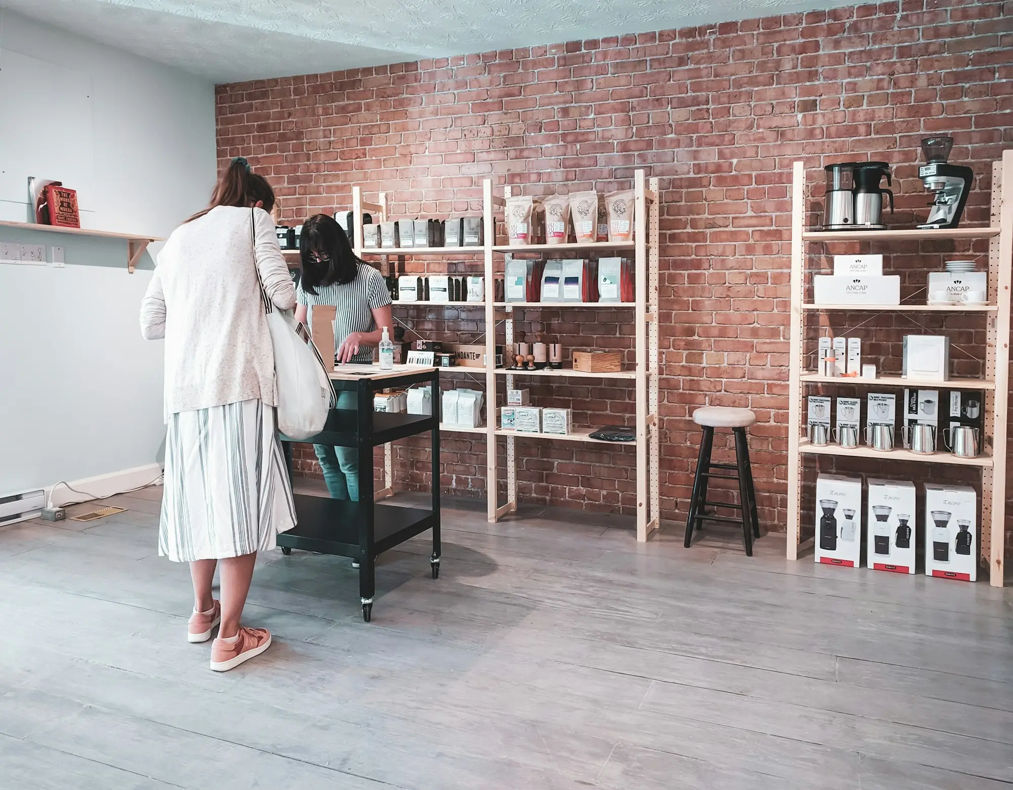 Boutique owner stock in an Australian small business setting