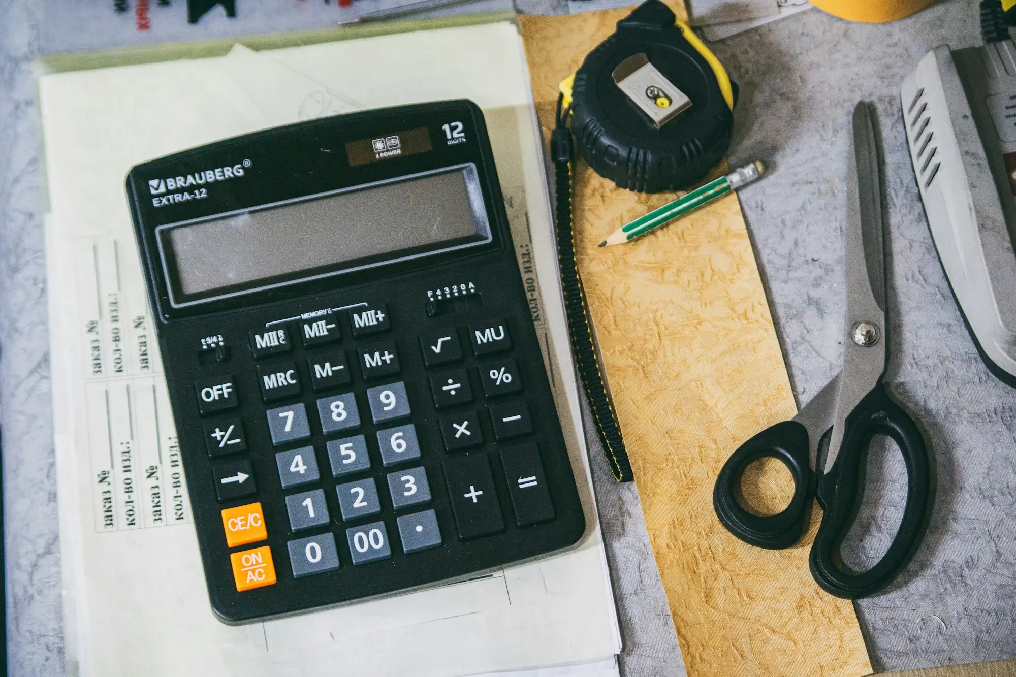 Cafe owner calculating costs counter