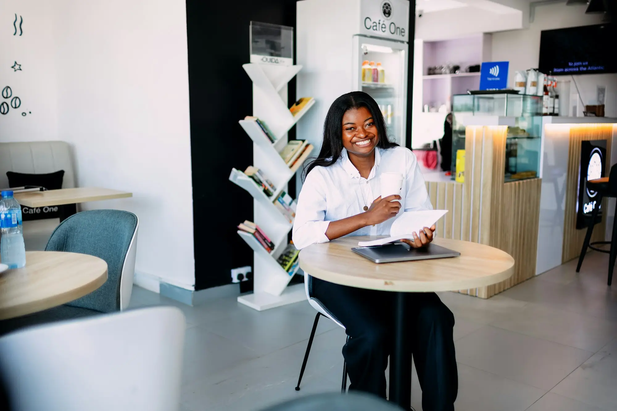 Owner reading loan contract kitchen table