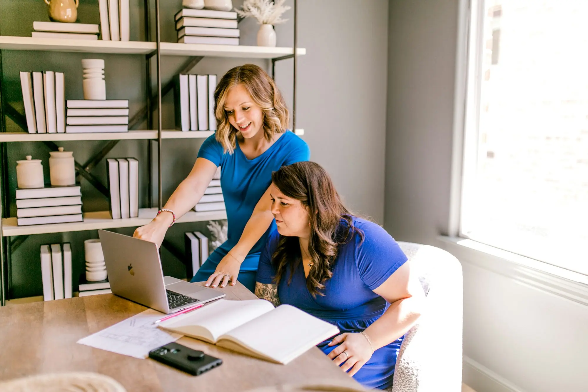 Owners comparing loan offers kitchen table