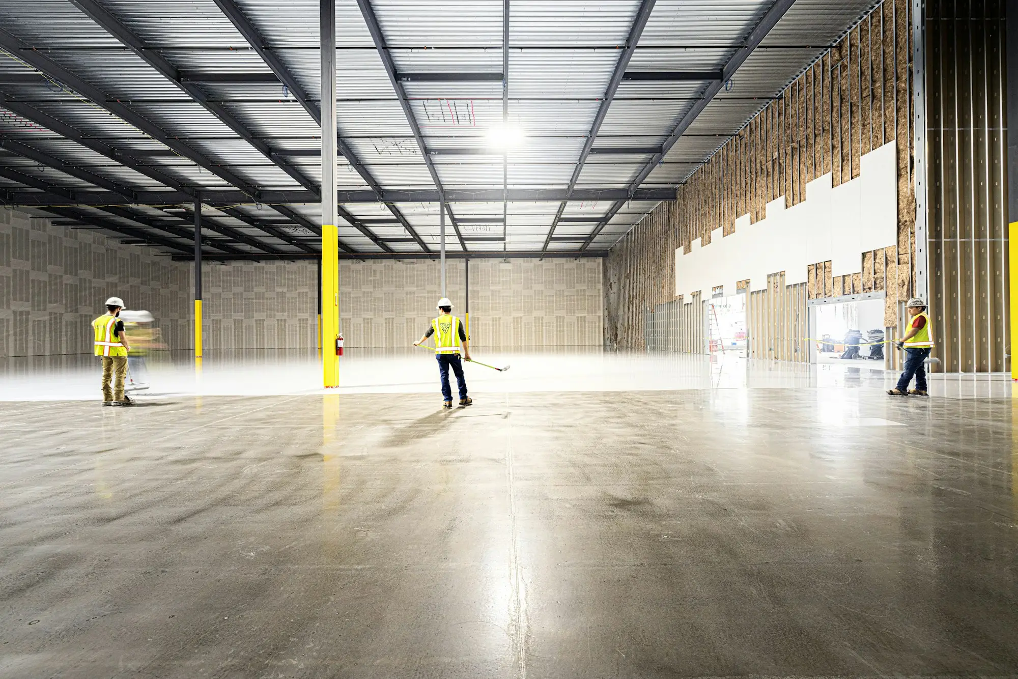 Owners inspecting warehouse purchase
