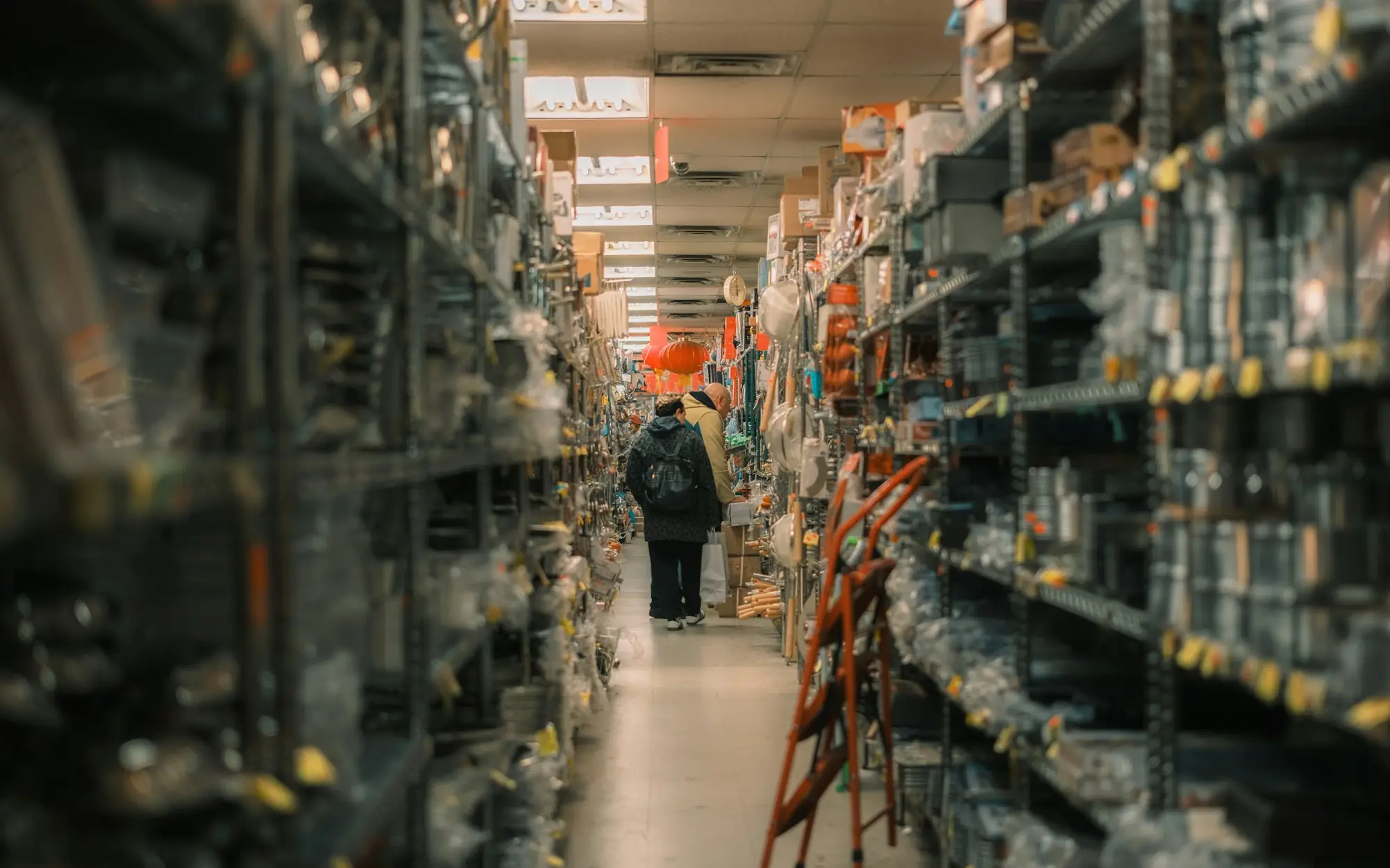 Aisle of stocked shelves in a retail stockroom